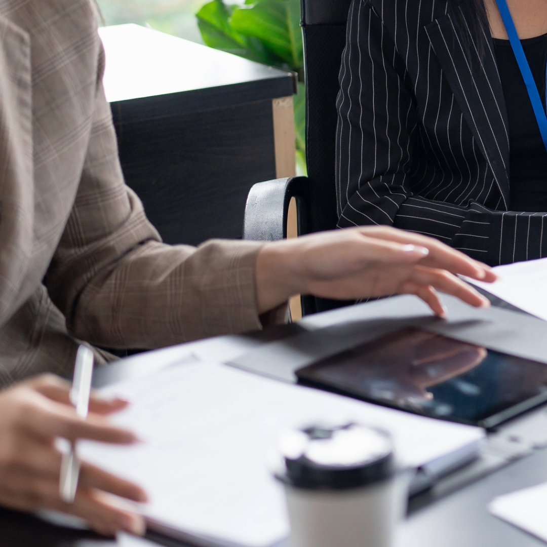 A person fills in a paper form.